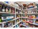 Well-stocked pantry with ample shelving for storage at 3773 E Donald Dr, Phoenix, AZ 85050