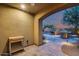 Outdoor kitchen and patio area with built-in grill and seating at 3773 E Donald Dr, Phoenix, AZ 85050
