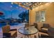 View of pool and patio from covered seating area at 3773 E Donald Dr, Phoenix, AZ 85050