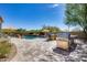 Luxury pool area with built-in grill and outdoor kitchen at 3773 E Donald Dr, Phoenix, AZ 85050