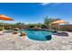 Serene pool and patio area with a tranquil waterfall feature at 3773 E Donald Dr, Phoenix, AZ 85050