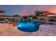 Relaxing pool and spa area with waterfall feature at 3773 E Donald Dr, Phoenix, AZ 85050