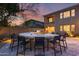 Round stone bar with seating for guests outdoors at 3773 E Donald Dr, Phoenix, AZ 85050