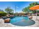 Relaxing kidney-shaped pool with waterfall feature at 3773 E Donald Dr, Phoenix, AZ 85050