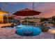 Freeform swimming pool with a waterfall feature at 3773 E Donald Dr, Phoenix, AZ 85050