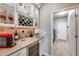 Wet bar with wine rack, beverage fridge, and coffee maker at 3773 E Donald Dr, Phoenix, AZ 85050
