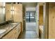 Double vanity bathroom with marble countertops and a bathtub at 4808 N 24Th St # 627, Phoenix, AZ 85016