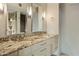 Double vanity bathroom with granite countertops at 4808 N 24Th St # 627, Phoenix, AZ 85016