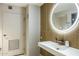 Chic bathroom with a round mirror and modern vanity at 4808 N 24Th St # 627, Phoenix, AZ 85016
