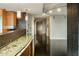 Granite countertop kitchen with modern cabinetry and breakfast bar at 4808 N 24Th St # 627, Phoenix, AZ 85016