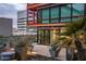 Evening view of a condo patio with city views and potted plants at 4808 N 24Th St # 627, Phoenix, AZ 85016