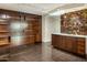 Modern wet bar with wooden cabinetry and shelving at 4808 N 24Th St # 627, Phoenix, AZ 85016