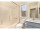 Clean bathroom featuring a shower/tub combo and light blue vanity at 524 N Leoma Ln, Chandler, AZ 85225