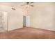 Spacious bedroom with ceiling fan and neutral carpeting at 524 N Leoma Ln, Chandler, AZ 85225