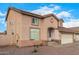 Two-story house with beige exterior, two-car garage, and rock landscaping at 524 N Leoma Ln, Chandler, AZ 85225