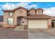 Two-story house with a beige exterior, two-car garage, and landscaping at 524 N Leoma Ln, Chandler, AZ 85225