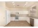 Modern kitchen with white cabinets and granite countertops at 524 N Leoma Ln, Chandler, AZ 85225