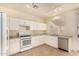 Modern kitchen with white cabinets and granite countertops at 524 N Leoma Ln, Chandler, AZ 85225