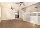 Open living room with high ceilings, carpeting, and a staircase at 524 N Leoma Ln, Chandler, AZ 85225