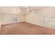 Spacious loft area with high ceilings, track lighting, and carpet at 524 N Leoma Ln, Chandler, AZ 85225