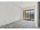 Spacious bedroom with sliding glass doors leading to the backyard, under construction at 7034 E Paradise Dr, Scottsdale, AZ 85254