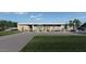Modern home's exterior with grassy lawn and walkway at 7034 E Paradise Dr, Scottsdale, AZ 85254