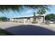 Contemporary home exterior with landscaping and driveway at 7034 E Paradise Dr, Scottsdale, AZ 85254