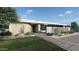 Modern home exterior with landscaping and walkway at 7034 E Paradise Dr, Scottsdale, AZ 85254