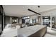 Modern kitchen with marble island and wine storage at 7034 E Paradise Dr, Scottsdale, AZ 85254