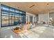 Open living space with floor-to-ceiling windows and under-construction features at 7034 E Paradise Dr, Scottsdale, AZ 85254