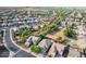 Aerial view of homes, a park, and open space in a residential area at 7720 S 72Nd Ave, Laveen, AZ 85339