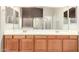 Bathroom boasts double sinks and wood cabinets at 8630 W Melinda Ln, Peoria, AZ 85382