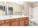 Bathroom with double vanity, shower, and toilet at 8630 W Melinda Ln, Peoria, AZ 85382