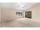 Bedroom with carpet, ceiling fan, and sliding glass doors to patio at 8630 W Melinda Ln, Peoria, AZ 85382