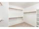 Spacious walk-in closet with ample shelving and hanging space at 8630 W Melinda Ln, Peoria, AZ 85382