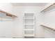 Large walk-in closet with shelves and hanging rods at 8630 W Melinda Ln, Peoria, AZ 85382