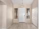 Bright entryway with tile flooring and coat closet at 8630 W Melinda Ln, Peoria, AZ 85382