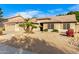 House exterior showcases desert landscaping and two-car garage at 8630 W Melinda Ln, Peoria, AZ 85382