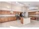Spacious kitchen with island, stainless steel appliances, and granite countertops at 8630 W Melinda Ln, Peoria, AZ 85382