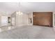 Living room features vaulted ceiling, carpet, and large windows at 8630 W Melinda Ln, Peoria, AZ 85382