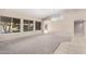 Living room boasts vaulted ceiling, carpet, and lots of natural light at 8630 W Melinda Ln, Peoria, AZ 85382