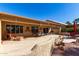 Outdoor space with travertine patio, desert landscaping, and plenty of room to entertain at 9237 E Diamond Dr, Sun Lakes, AZ 85248