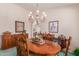 Elegant dining room with oval wood table and wooden chairs at 9237 E Diamond Dr, Sun Lakes, AZ 85248