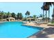 Resort-style pool with multiple seating areas at 9237 E Diamond Dr, Sun Lakes, AZ 85248