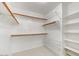 Large walk-in closet with shelving and hanging rods at 9279 E Camino Del Santo --, Scottsdale, AZ 85260