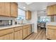 View of kitchen with wood cabinets, stainless steel appliances, and light countertops at 9444 E Minnesota Ave, Sun Lakes, AZ 85248