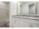Well-lit bathroom includes a granite countertop double vanity with a tub and shower at 9658 E Tahoe Cir, Mesa, AZ 85212