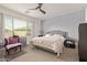 Spacious bedroom with king-size bed and large window at 9658 E Tahoe Cir, Mesa, AZ 85212