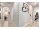 Bright hallway with wood-look floors and access to other rooms at 9658 E Tahoe Cir, Mesa, AZ 85212