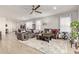 Bright living room featuring a comfy sofa and large windows at 9658 E Tahoe Cir, Mesa, AZ 85212